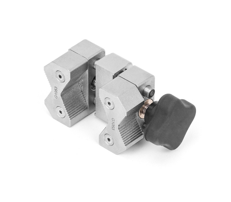 G1053 Universal V-Jaw Grip with serrated, reversible aluminum jaws that effectively grip a wide range of sample shapes and sizes.