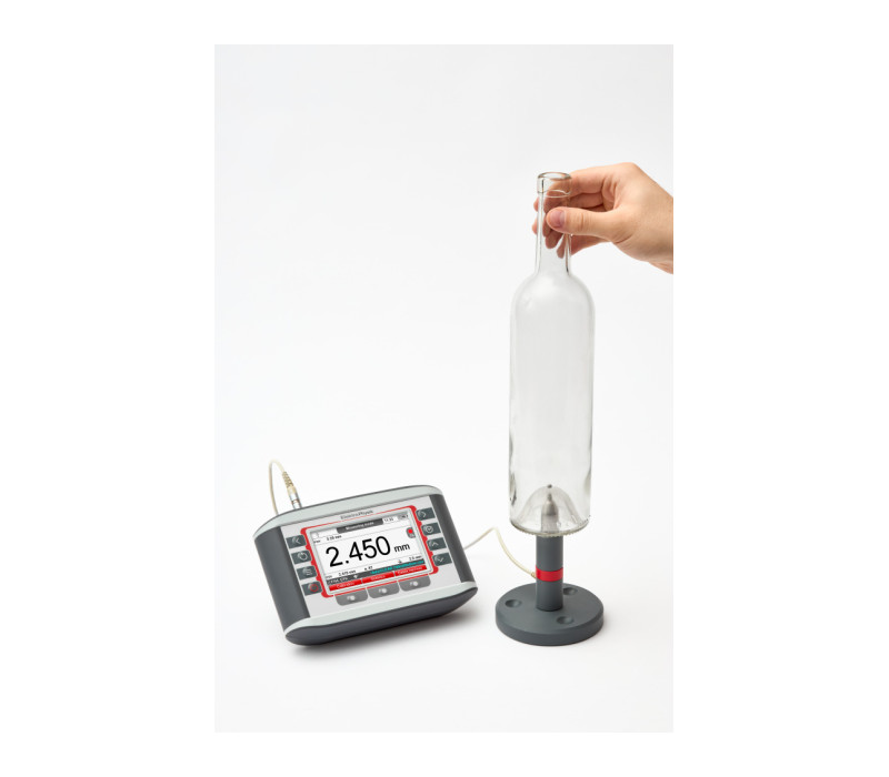MiniTest FH with standard probe FH 4 in stand for measuring the thickness of a glass bottle